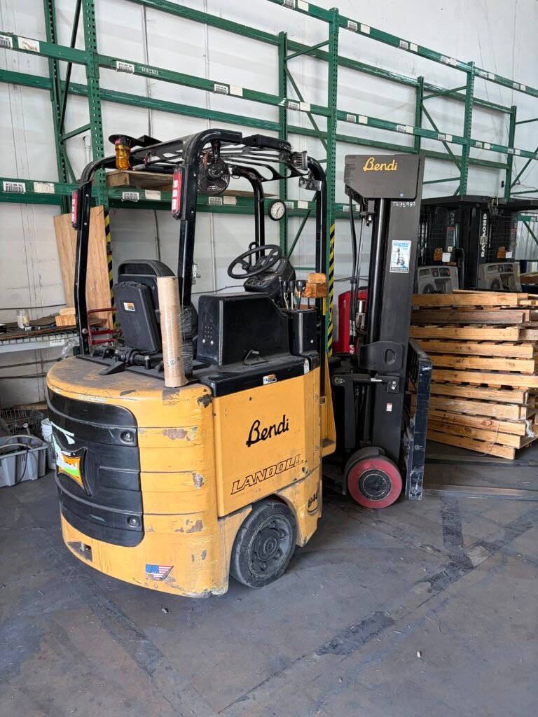 Side and rear view of the yellow Landoll Bendi B40AC articulated forklift offered by FixtureUSA.